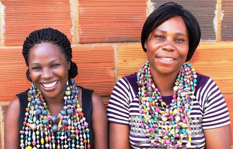 Uganda Kampala girls make paper bead jewelry necklaces